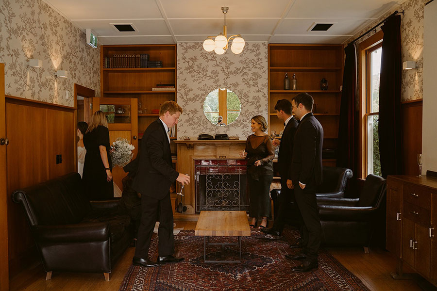 winehouse queenstown events venue guests in wood panelled drawing room